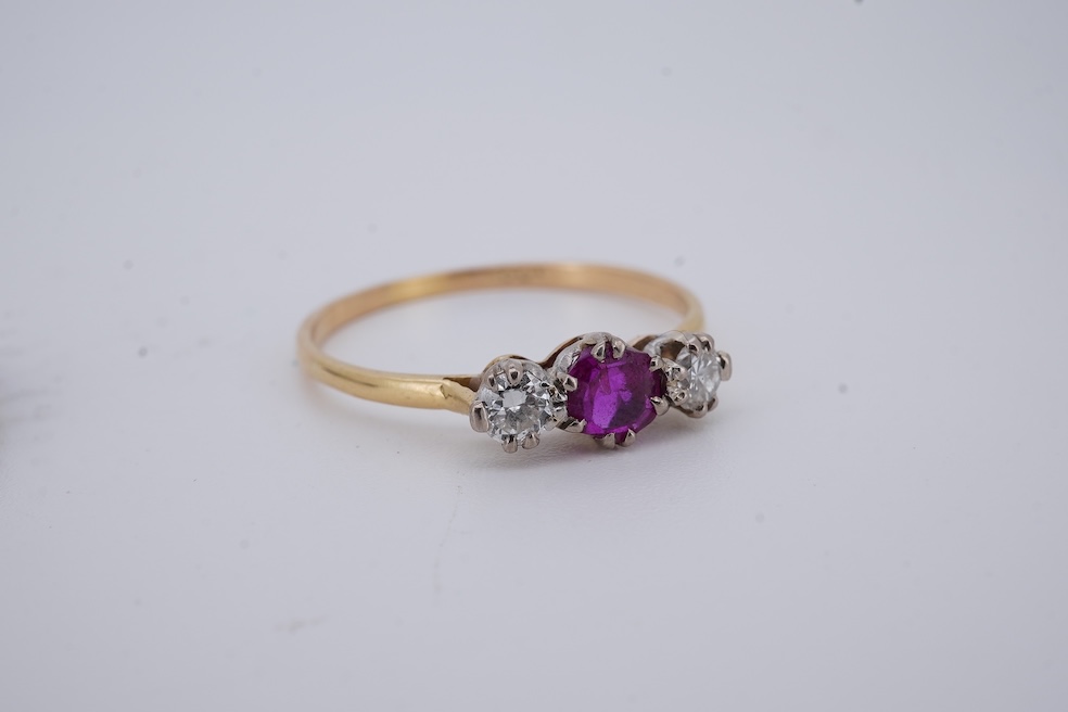 A yellow metal, stamped 18ct, ruby and diamond set three stone ring, size W, together with a yellow metal ruby and diamond set full eternity ring, size Q, gross weight 4.4 grams. Condition - poor to fair